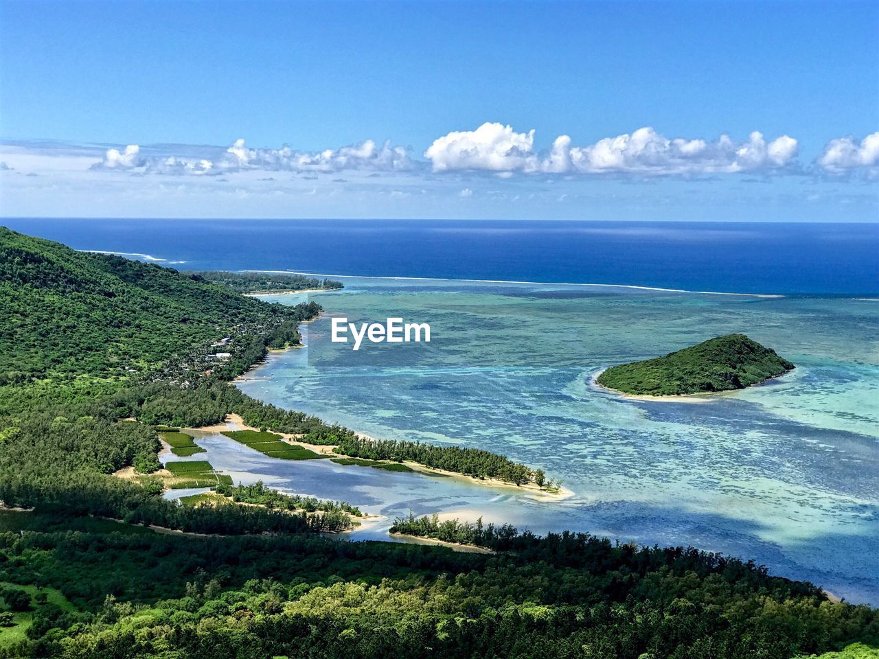 Scenic view of sea against blue sky