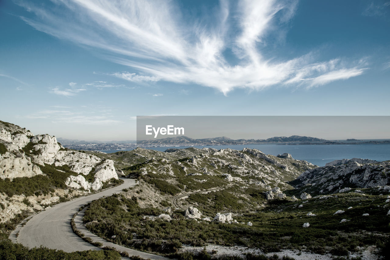 Scenic view of mountains against cloudy sky