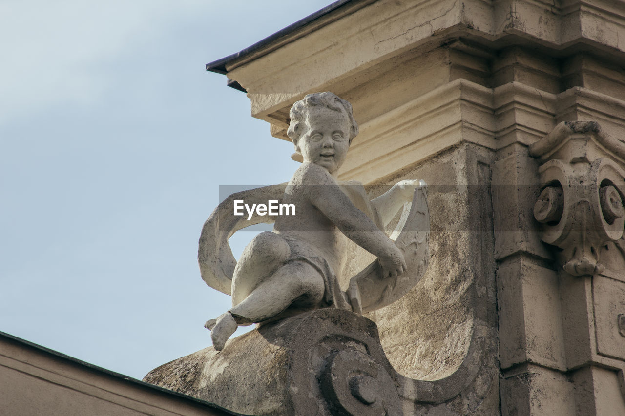 Low angle view of statue against sky