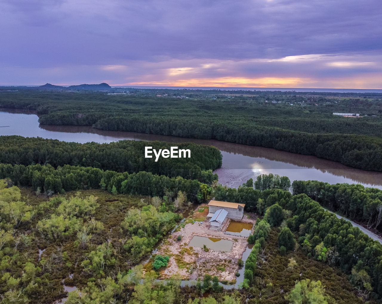 HIGH ANGLE VIEW OF GREEN LANDSCAPE AGAINST SKY