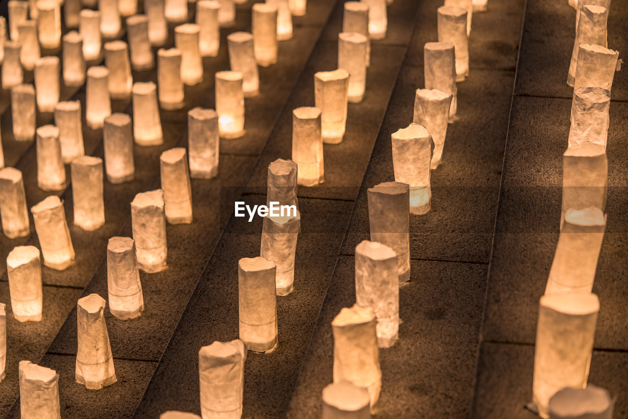 Handmade japanese washi paper lanterns aligned in circles illuminating the zojoji temple.