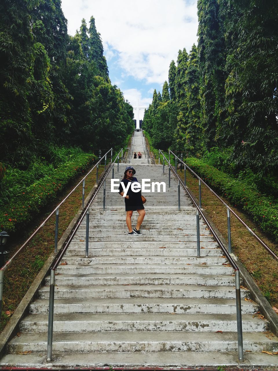 Low angle view of woman standing on steps