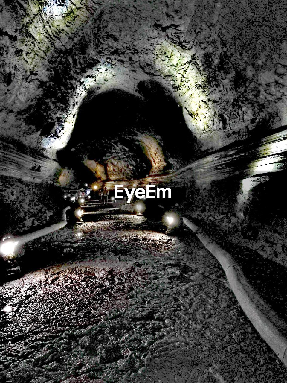 ILLUMINATED TUNNEL SEEN THROUGH CAVE