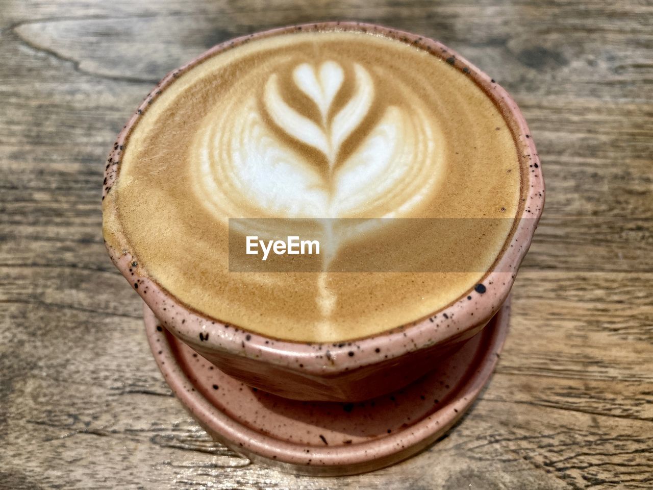 drink, frothy drink, food and drink, refreshment, coffee, cappuccino, cup, hot drink, froth art, coffee cup, still life, mug, latte, table, close-up, wood, indoors, food, no people, flat white, creativity, freshness, cortado, high angle view, brown, pattern, heart shape