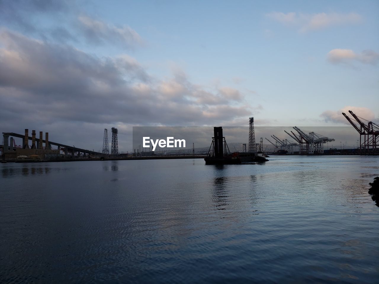 VIEW OF BRIDGE OVER SEA AGAINST SKY