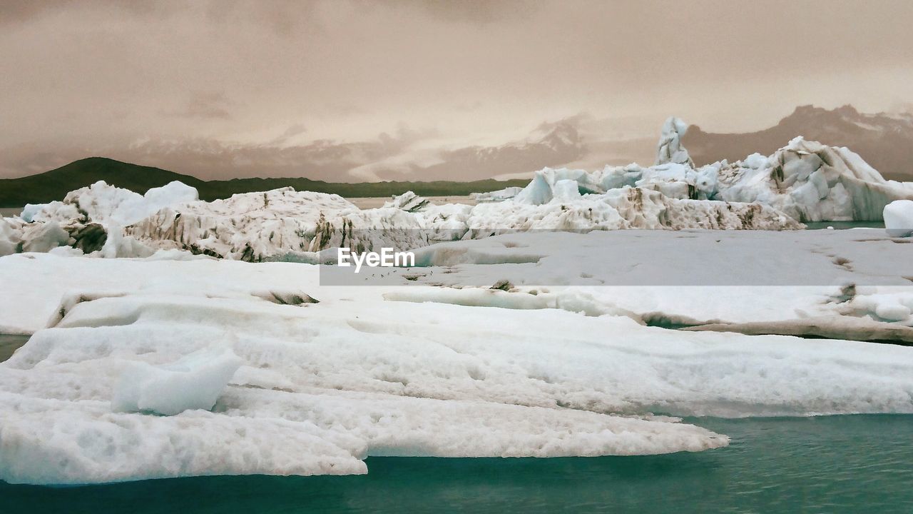 Scenic view of frozen sea against sky