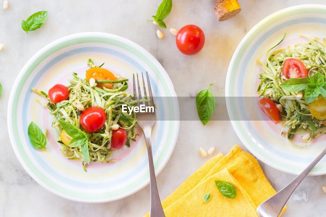 Plates with zucchini spaghetti