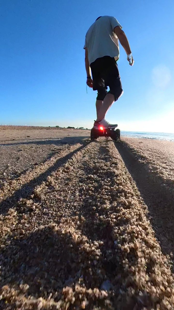 one person, sky, full length, nature, land, sunlight, day, adult, motion, clear sky, blue, men, sand, leisure activity, sports, sunny, landscape, lifestyles, rear view, footwear, environment, activity, outdoors, sea, person, copy space, casual clothing, vitality, standing, horizon