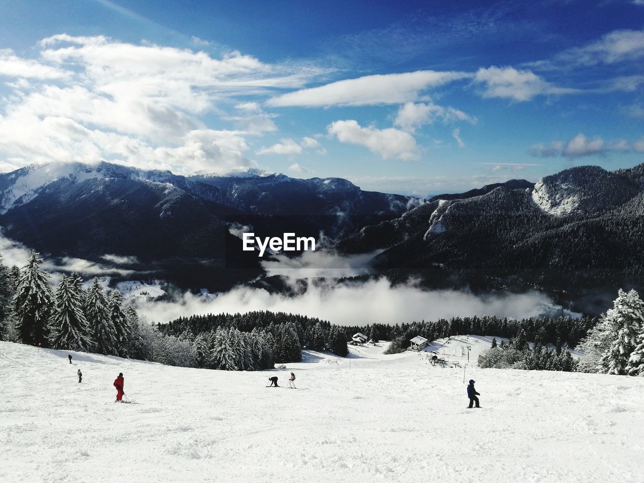 Scenic view on mountains against sky during winter
