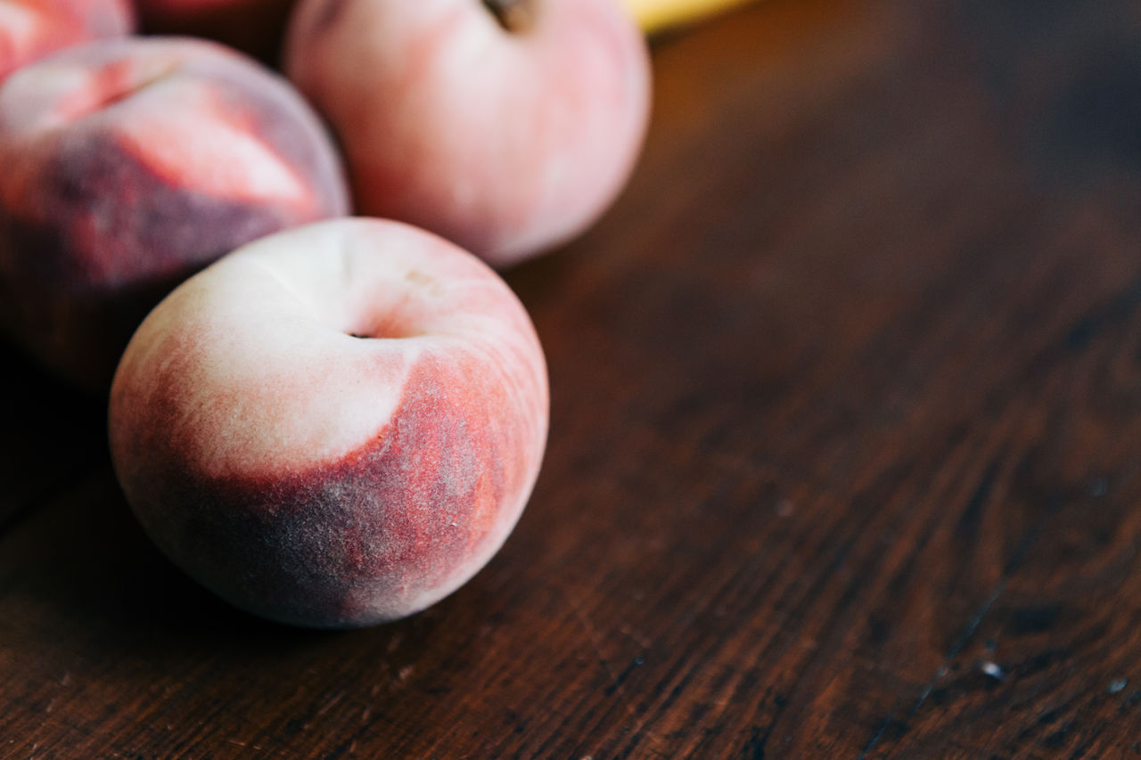 Close-up of peach on table