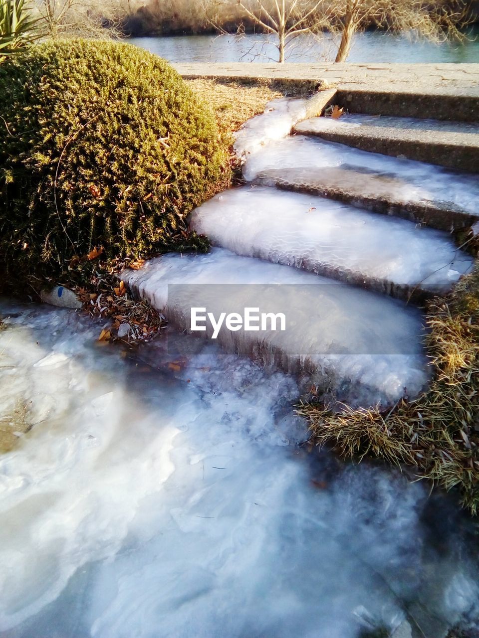 CLOSE-UP OF FROZEN WATER IN WINTER