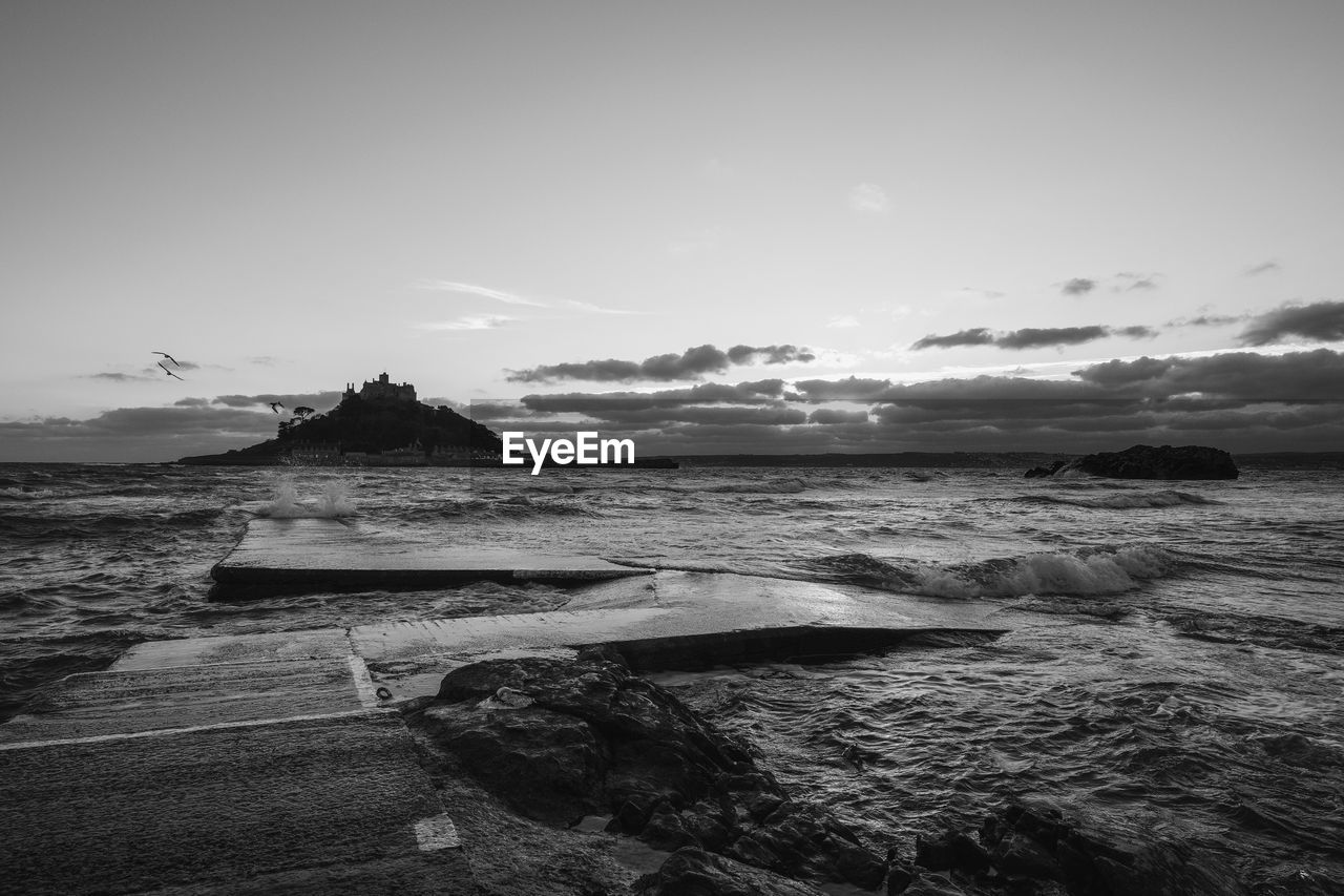 Scenic view of beach against sky