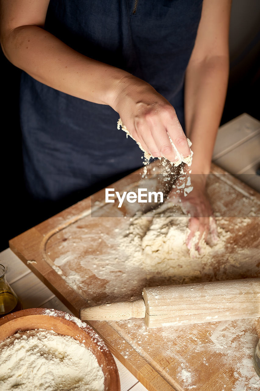 Midsection of woman preparing food