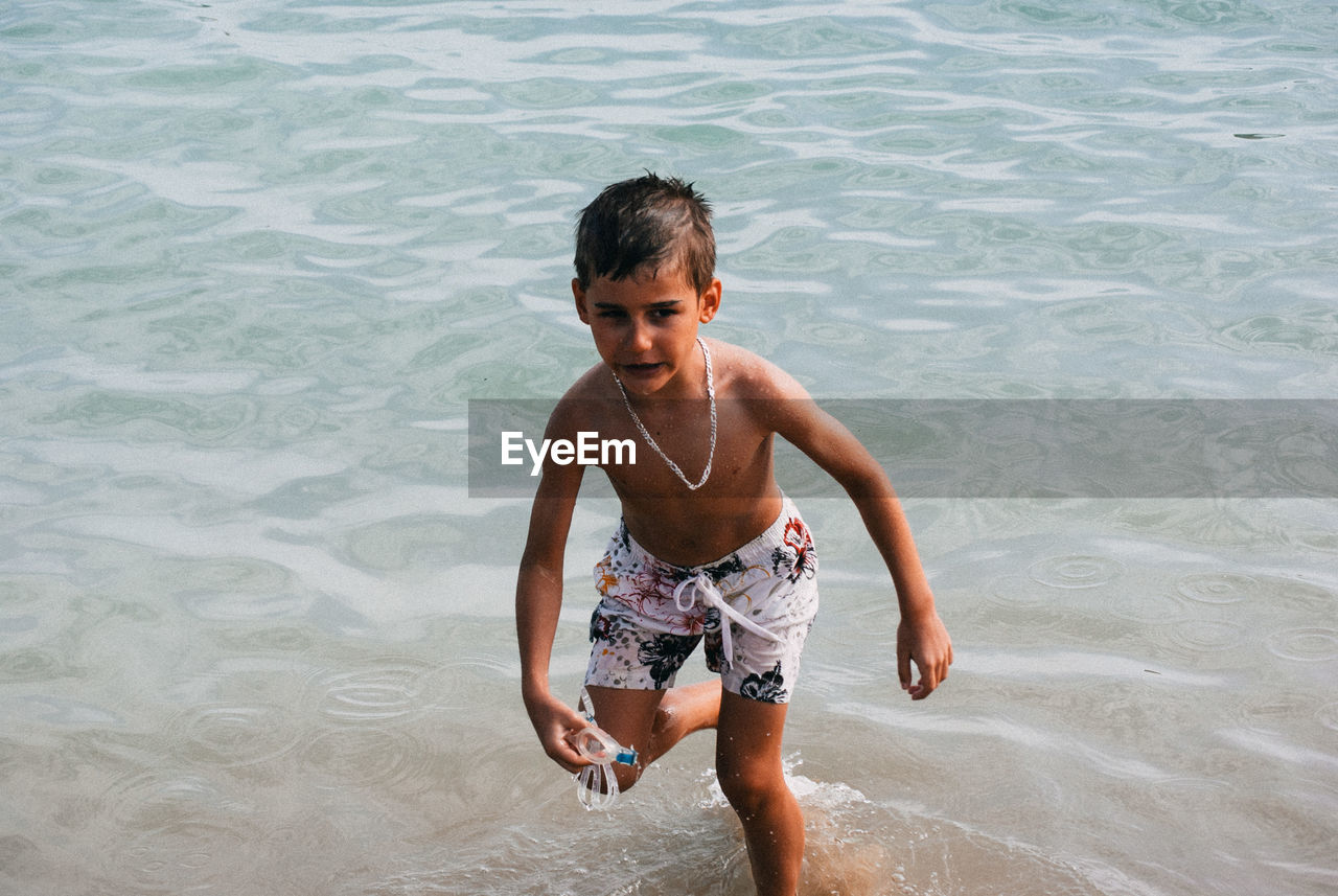 Boy running in sea