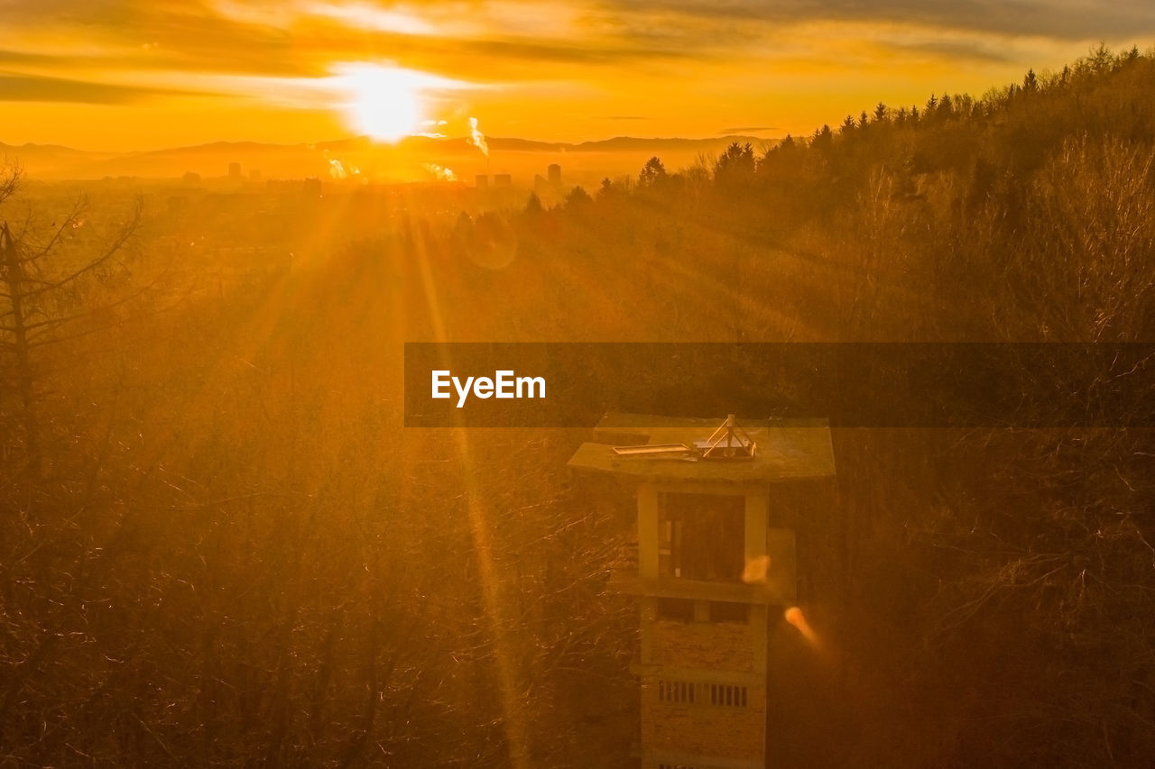 SCENIC VIEW OF SUNSET OVER LAND