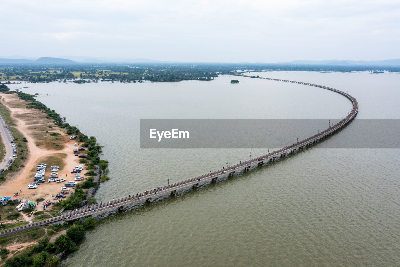 Aerial view of railway bridge above the reservoir of pa sak jolasid dam at lopburi, amazing thailand 