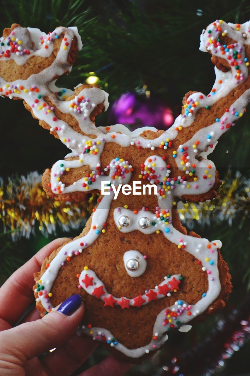 Cropped image of woman holding dessert