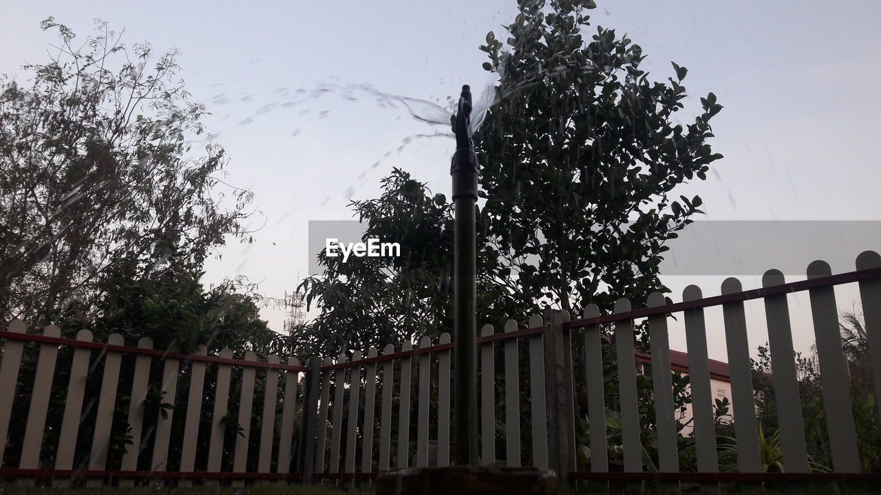 LOW ANGLE VIEW OF SILHOUETTE FENCE AGAINST SKY