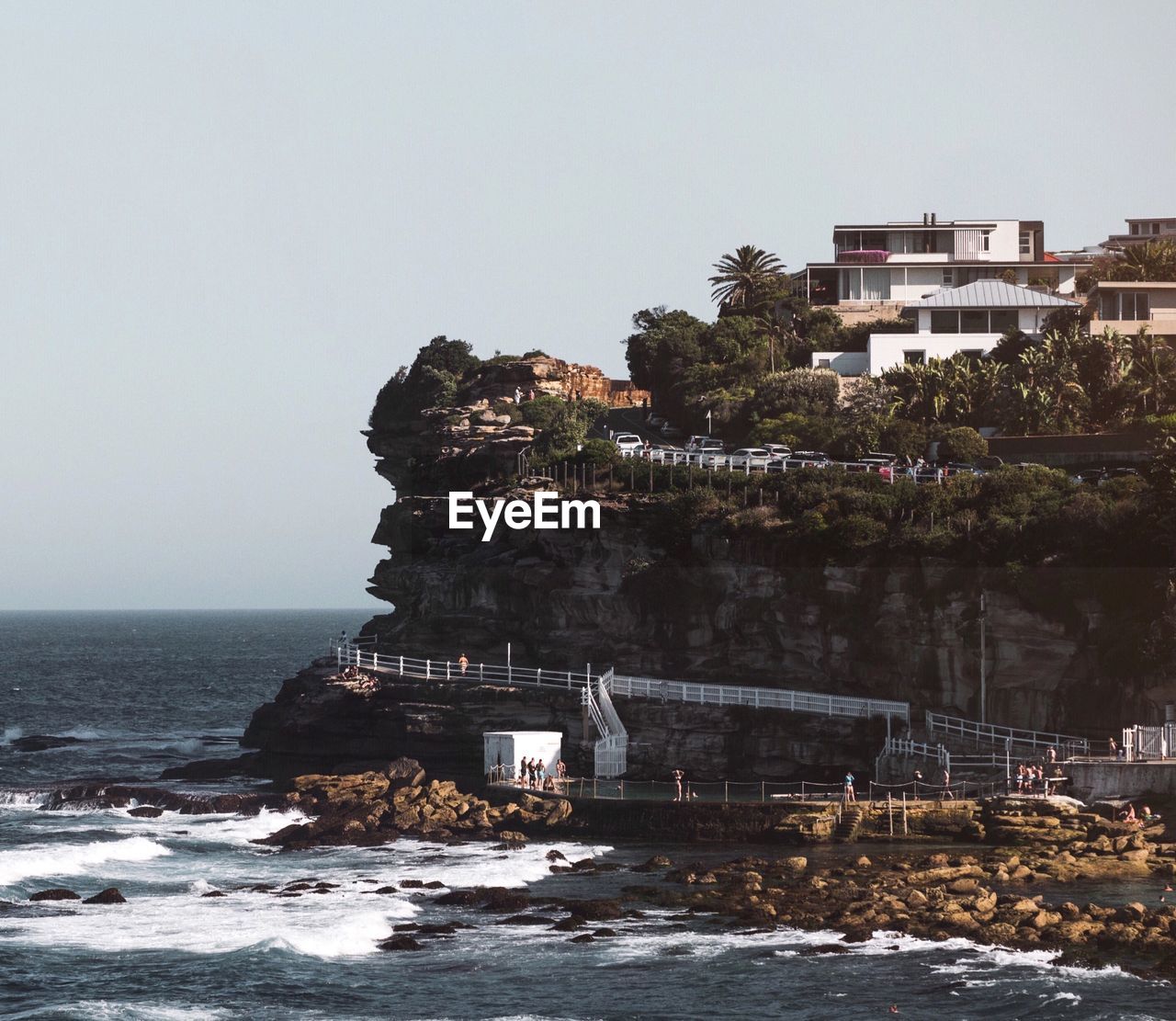 VIEW OF SEA WITH BUILDINGS IN BACKGROUND