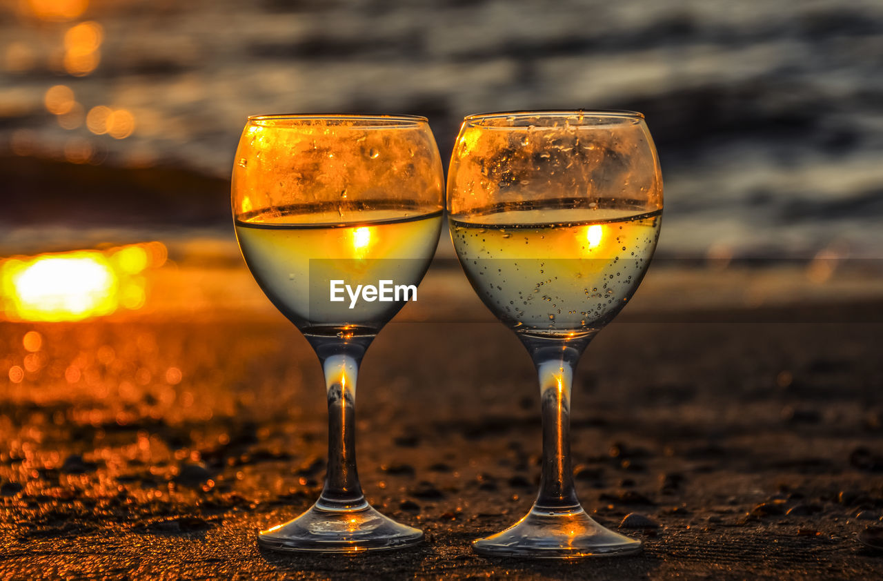 CLOSE-UP OF WINEGLASS ON TABLE