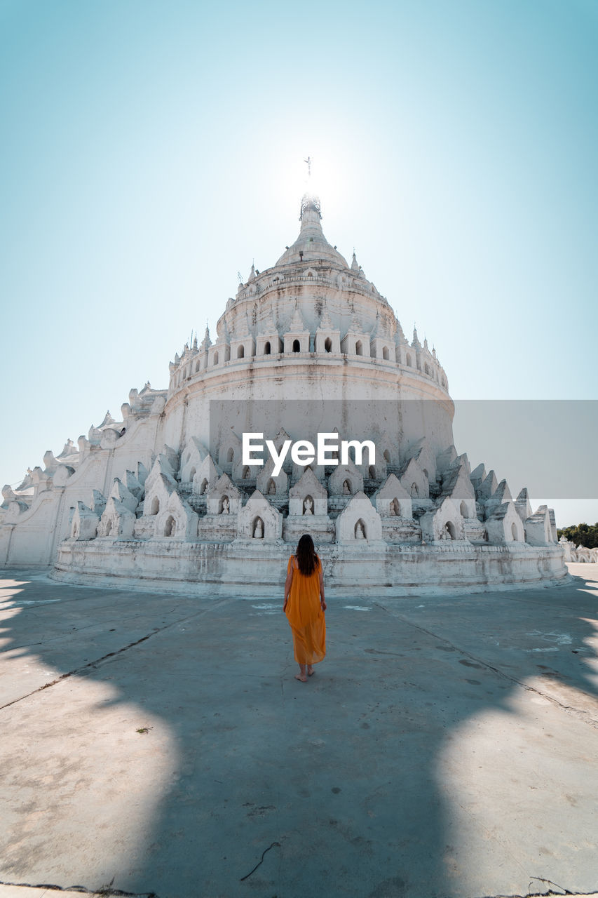 REAR VIEW OF WOMAN IN TEMPLE