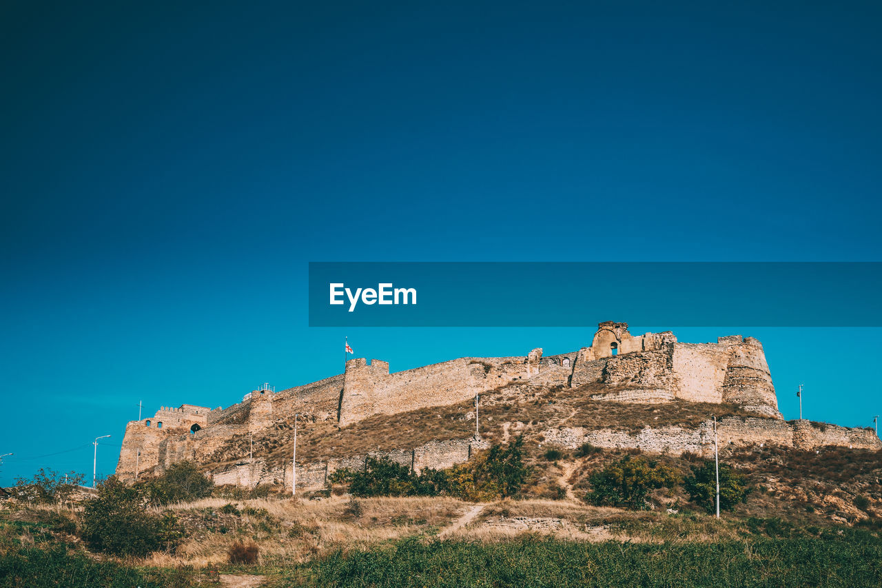 LOW ANGLE VIEW OF FORT AGAINST SKY