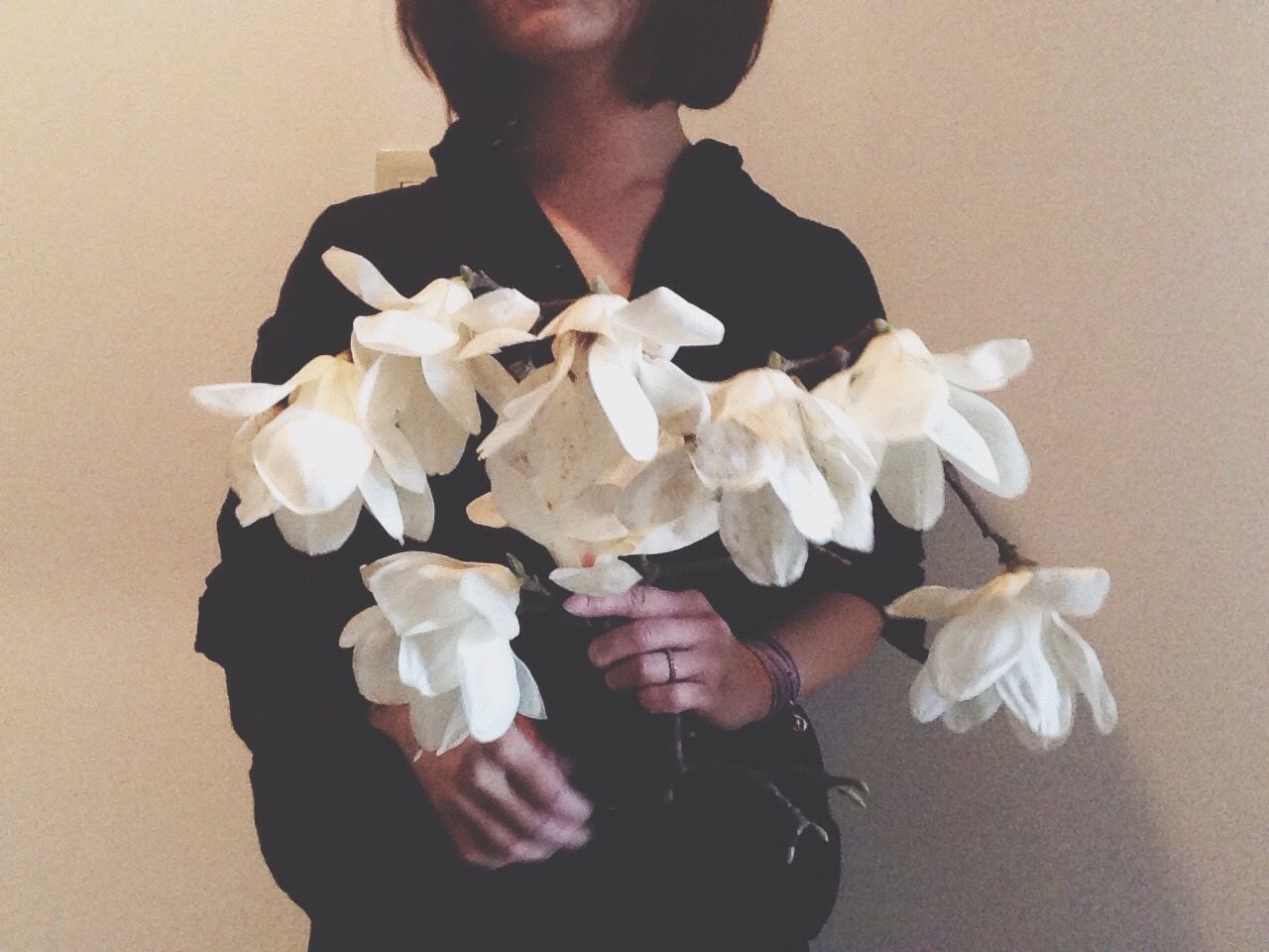 WOMAN HOLDING FLOWERS