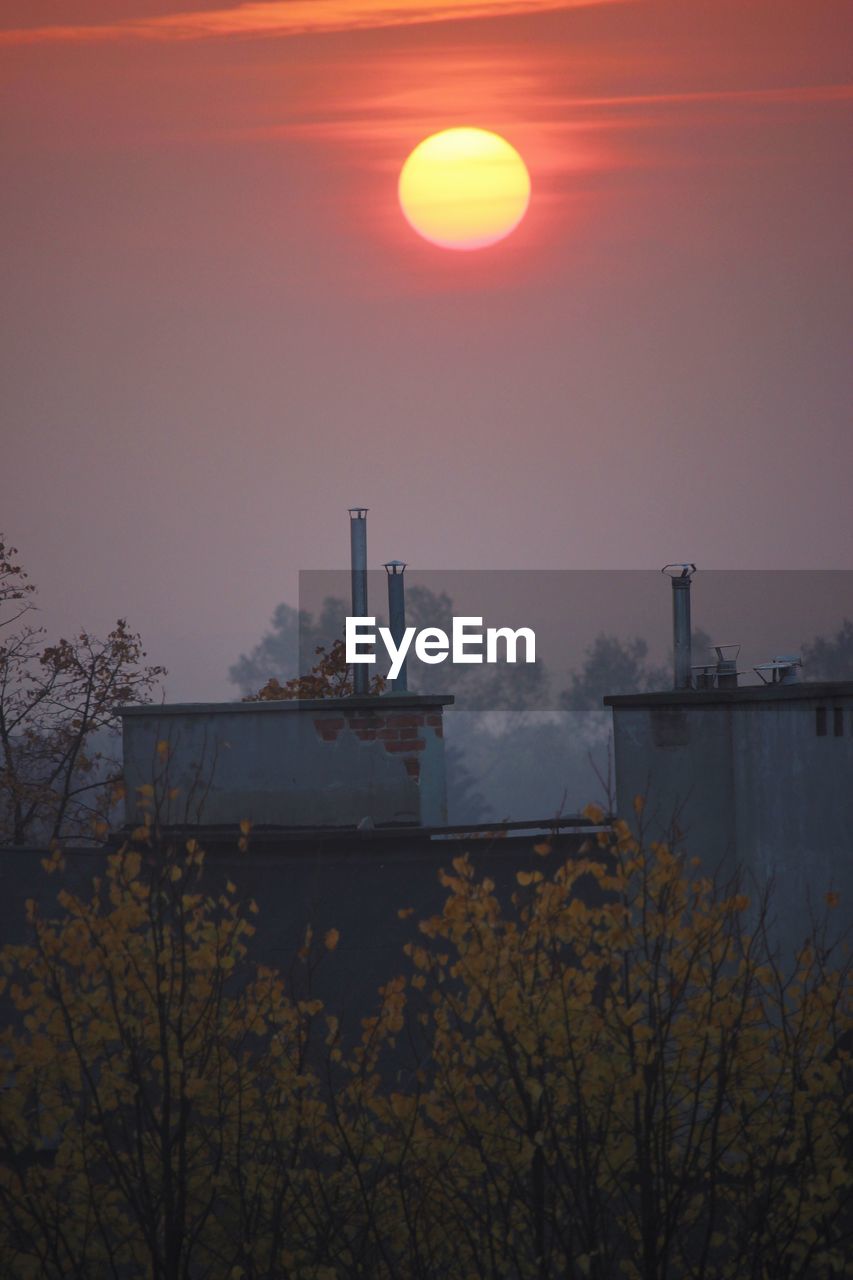 SCENIC VIEW OF FACTORY AGAINST SKY DURING SUNSET