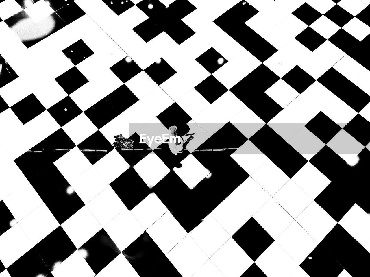 High angle view of worker walking on pattern floor