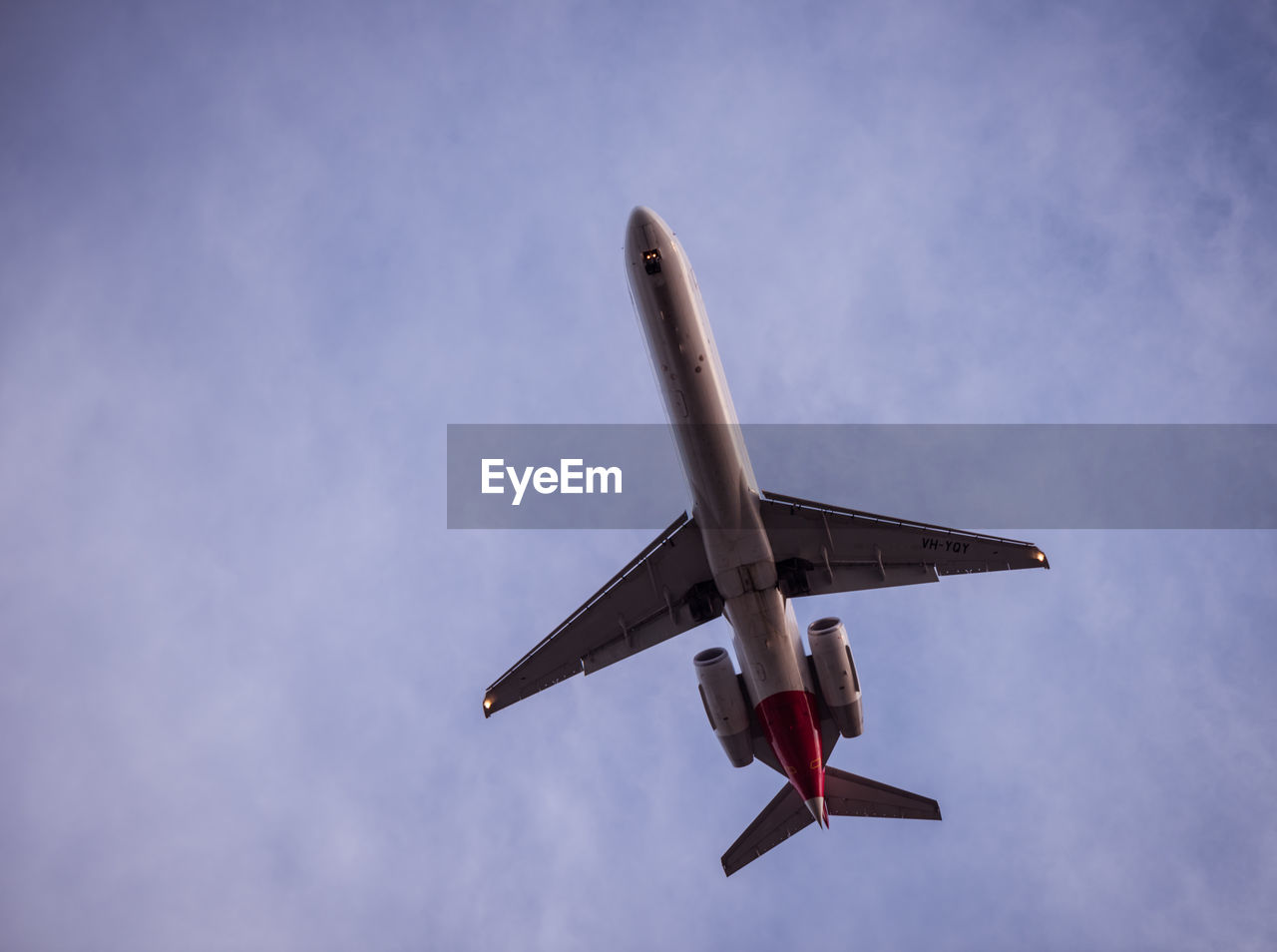 LOW ANGLE VIEW OF AIRPLANE IN SKY