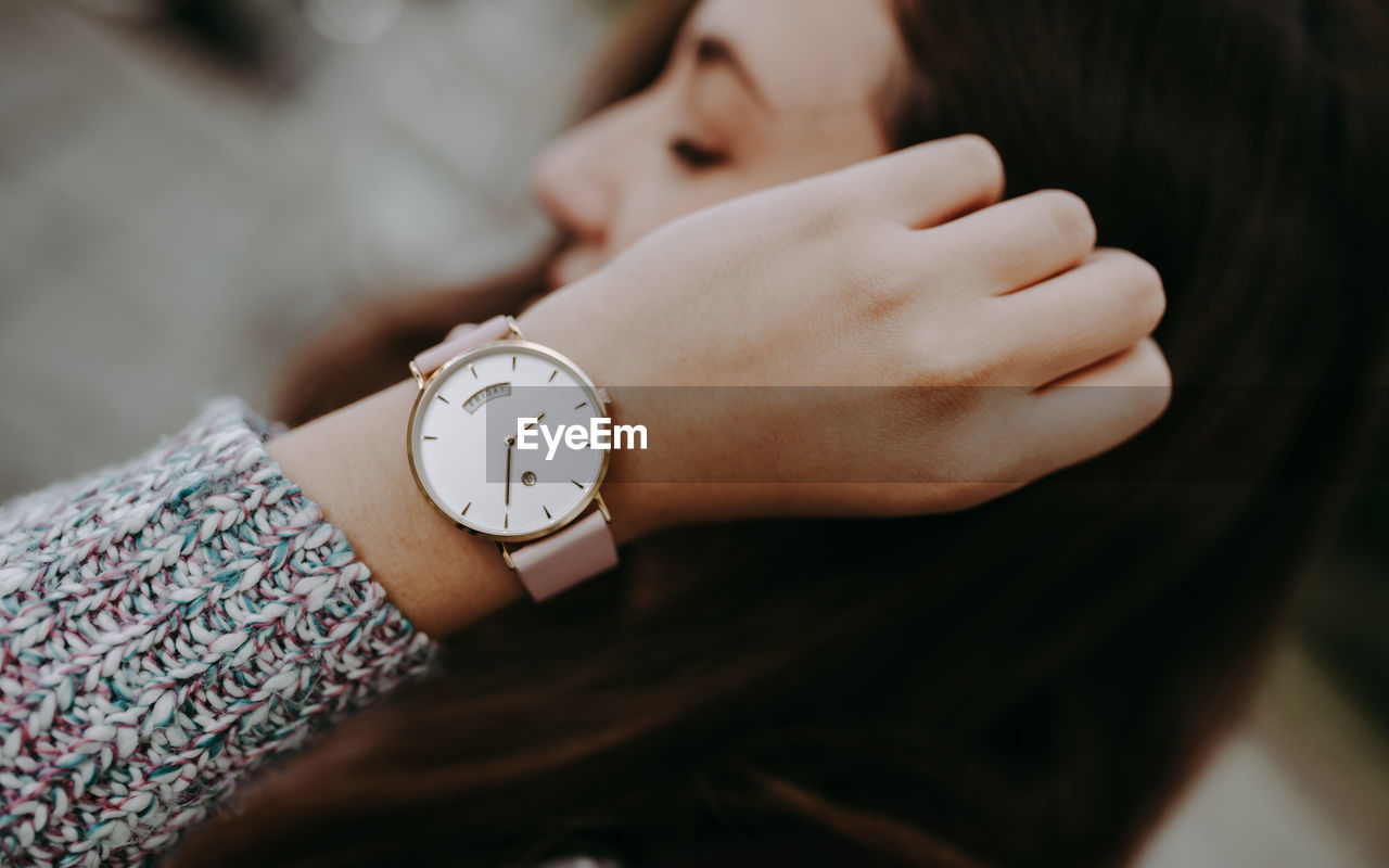 Close-up of woman hand with wristclock