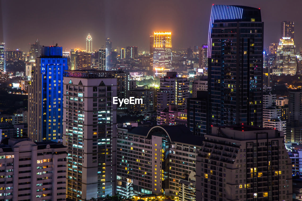 ILLUMINATED MODERN BUILDINGS IN CITY