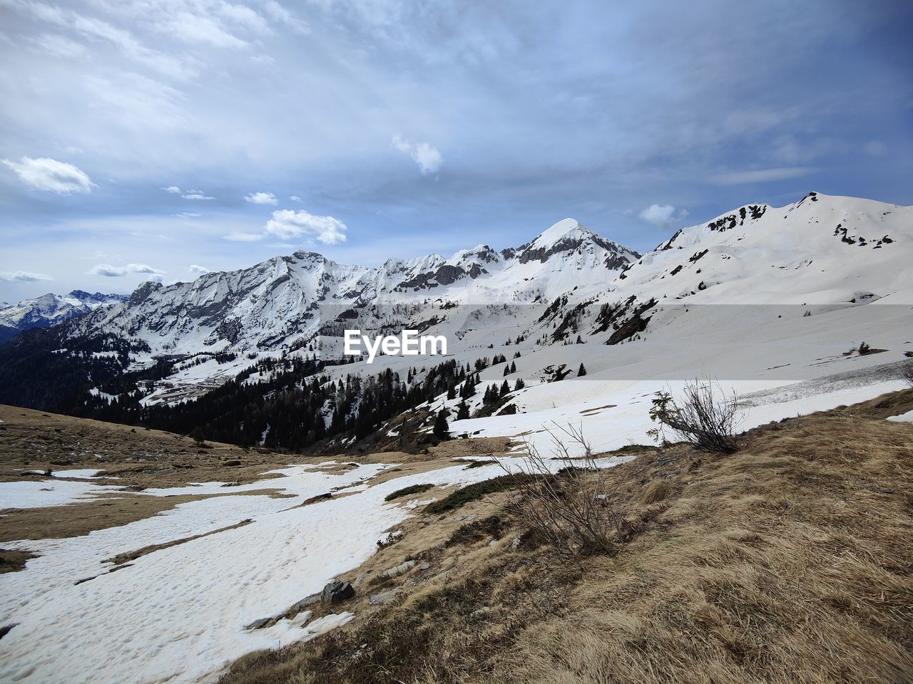 snow, cold temperature, mountain, winter, environment, landscape, scenics - nature, sky, beauty in nature, cloud, mountain range, snowcapped mountain, nature, ridge, travel destinations, land, travel, no people, tranquility, tranquil scene, non-urban scene, wilderness, plateau, outdoors, day, summit, tourism, ice, mountain peak, frozen, extreme terrain, mountain pass, white, adventure