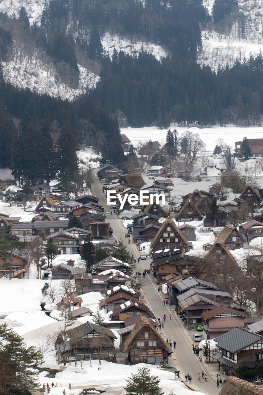 HIGH ANGLE VIEW OF HOUSES IN SNOW