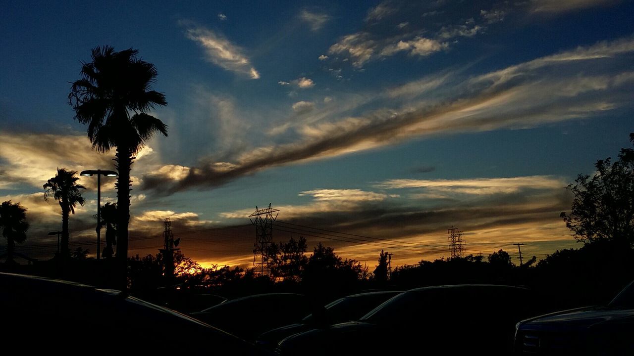 VIEW OF ROAD AGAINST CLOUDY SKY AT SUNSET