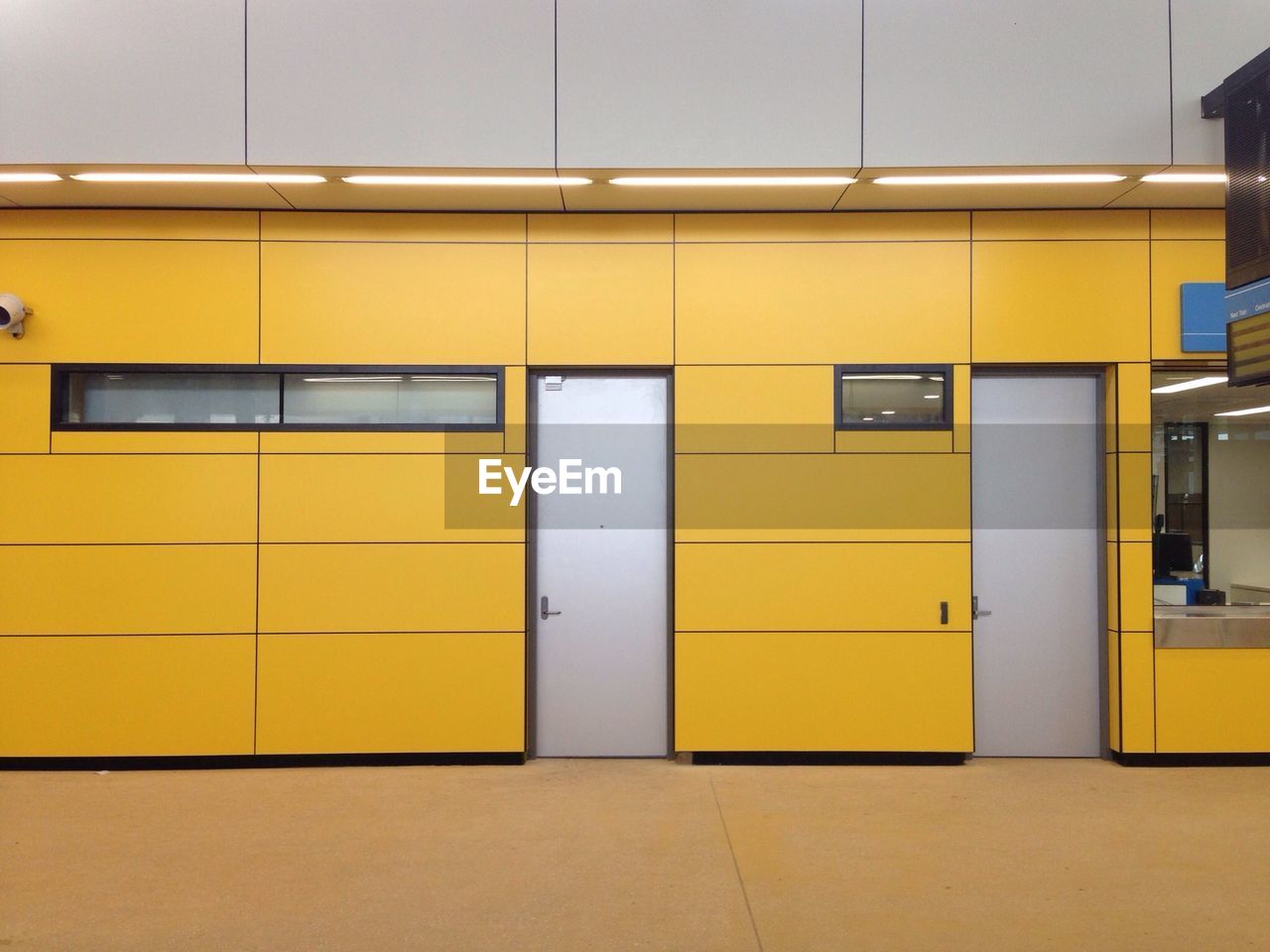 Closed doors in yellow building