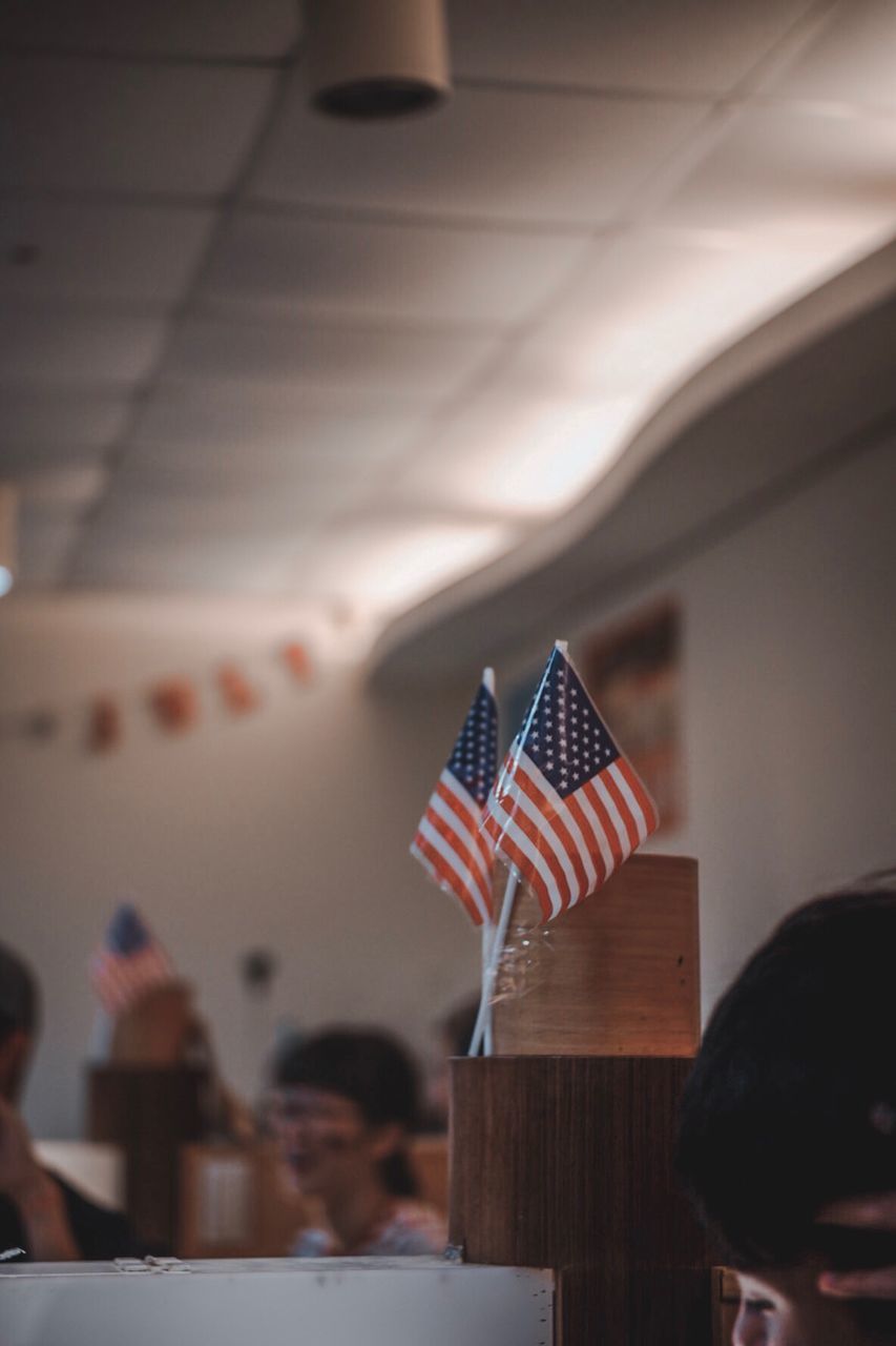 Close-up of american flags in cafe