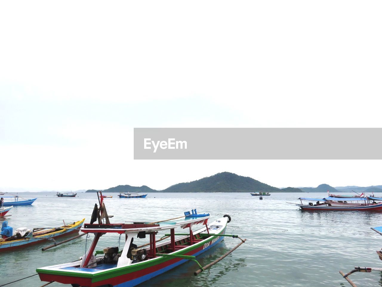 VIEW OF BOATS IN SEA AGAINST CLEAR SKY