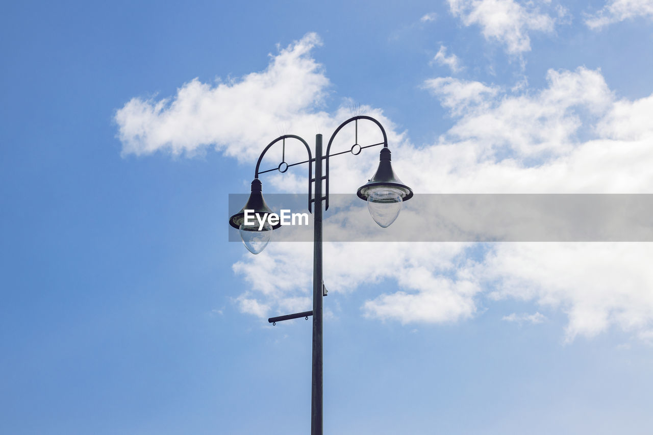 Low angle view of street light against sky