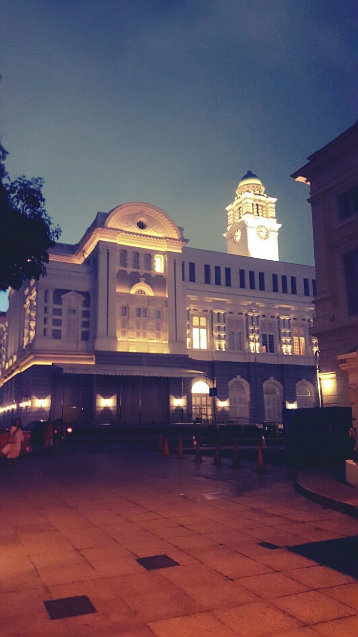 VIEW OF ILLUMINATED BUILDINGS AT NIGHT