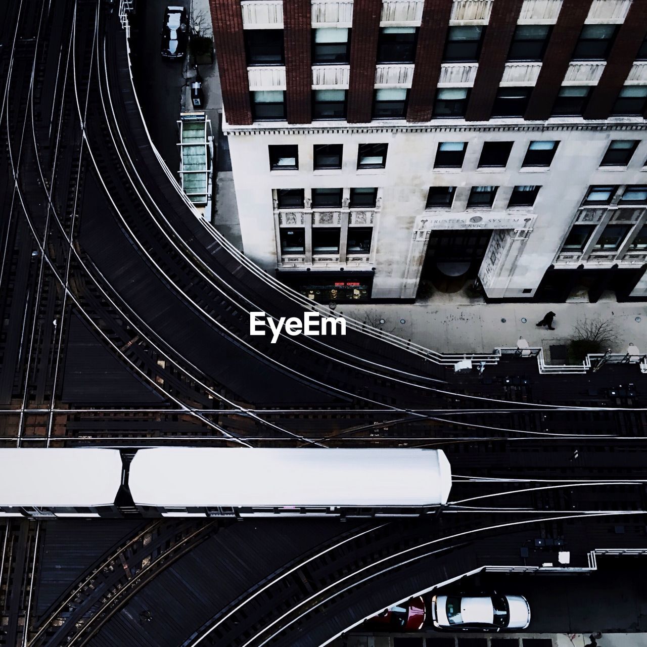 High angle view of vehicles on road amidst buildings