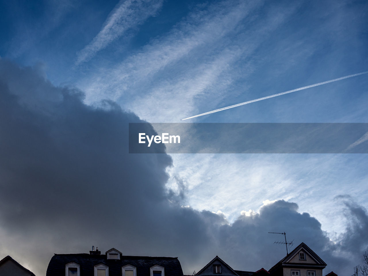 Low angle view of vapor trails in sky