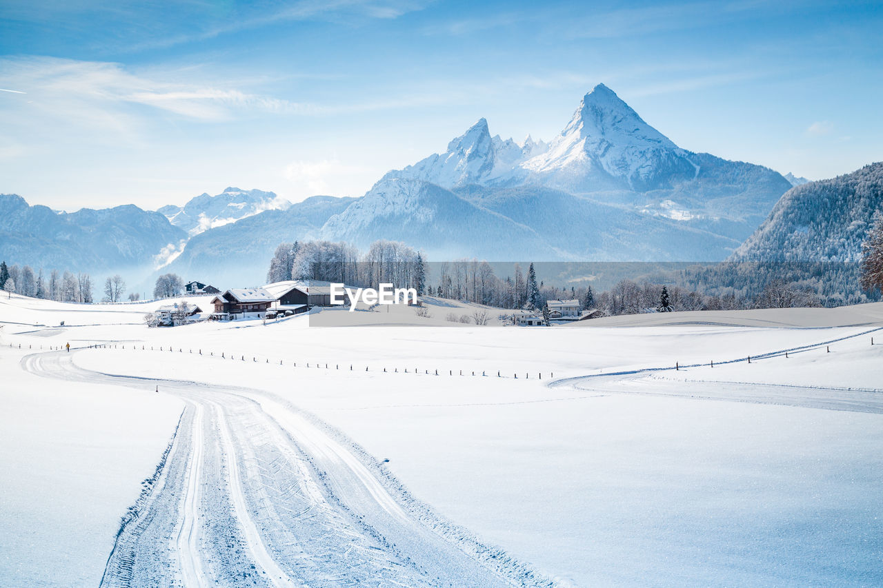 Scenic view of snow covered mountains against sky