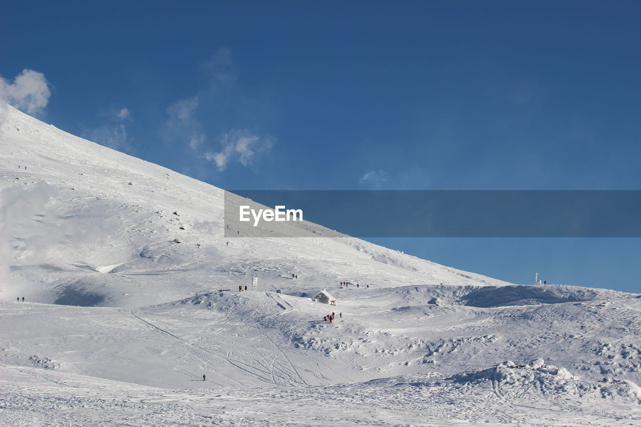 Scenic view of snowcapped mountain against sky