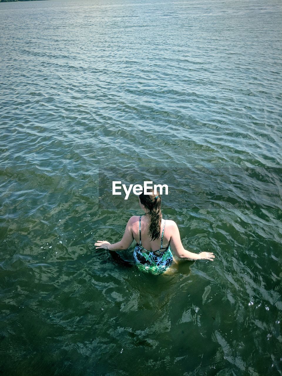 High angle view of woman in river