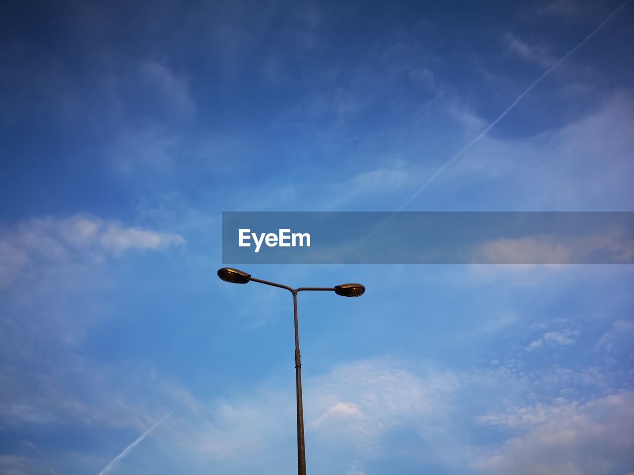 LOW ANGLE VIEW OF STREET LIGHTS AGAINST SKY