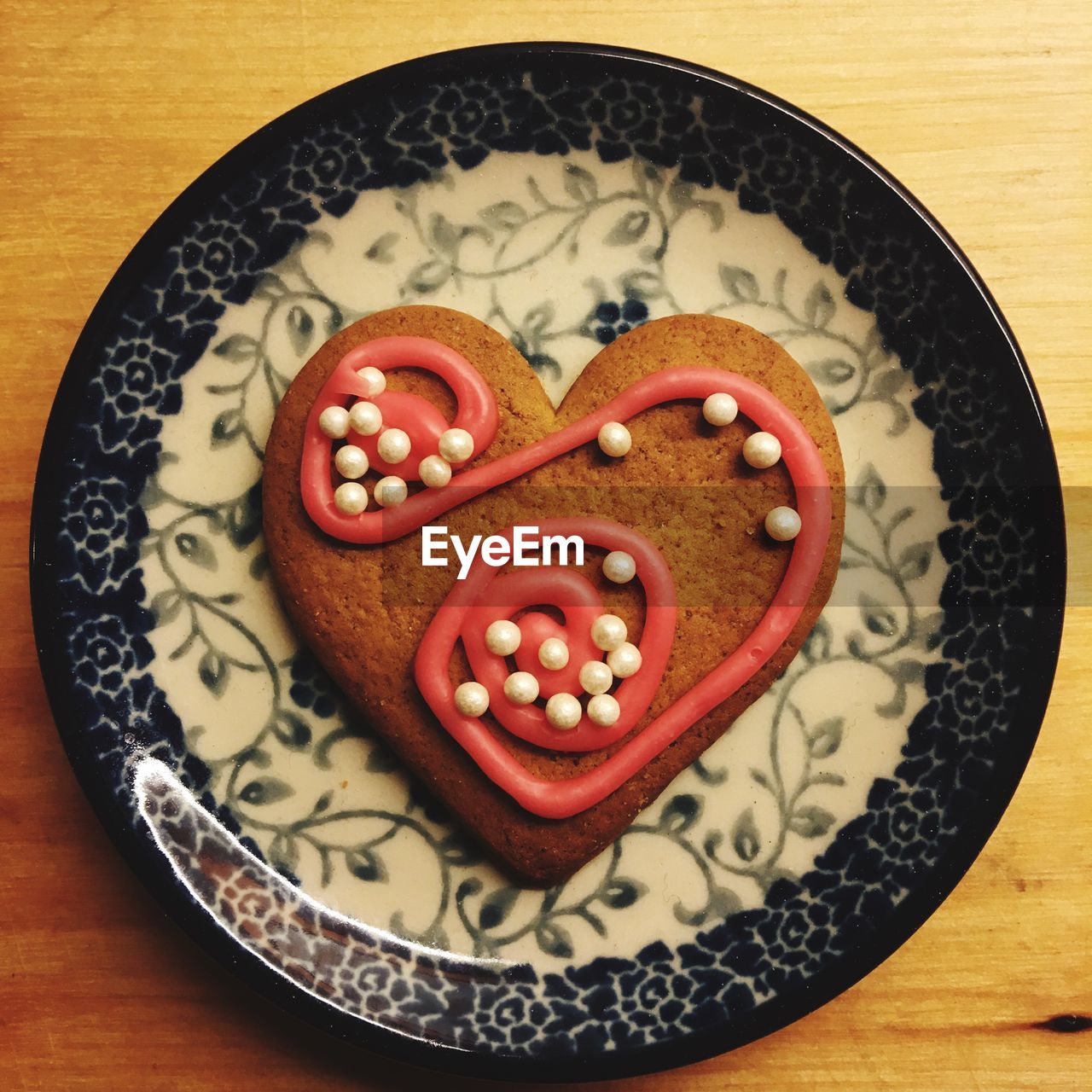 Directly above shot of heart shape sweet food in plate on table