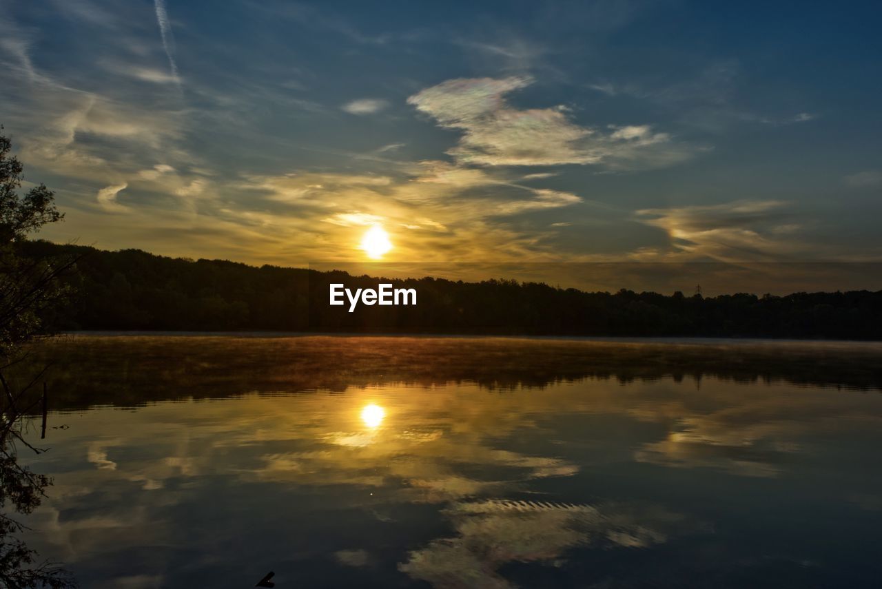 SCENIC VIEW OF SUNSET OVER LAKE