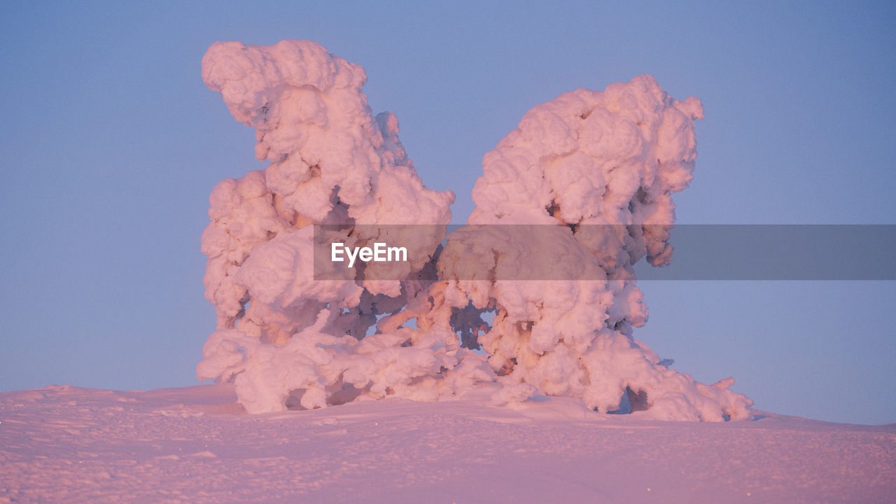 low angle view of rock formations in sky