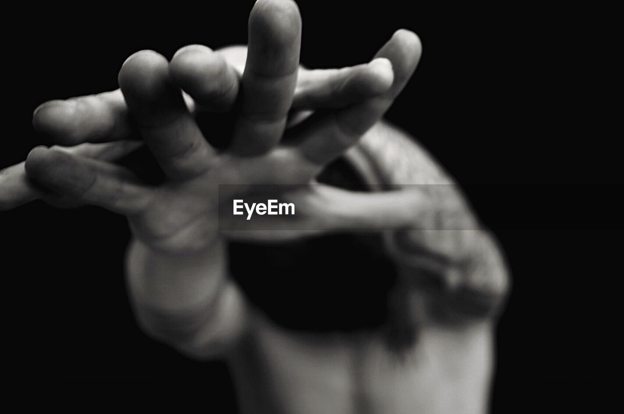 CLOSE-UP OF CROPPED HANDS